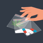 Drug Trade. Drug deal. The dealer holds the dose in package. Tablets, cocaine and marijuana. Abuse and addiction.