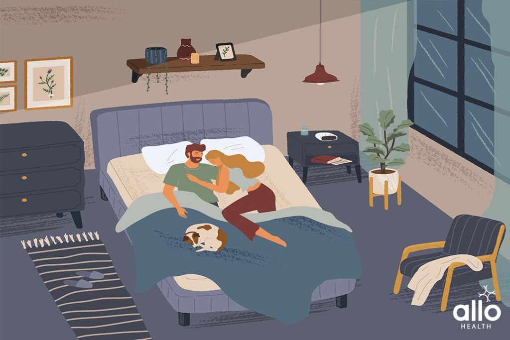 How To Reduce Pain During Sex? 1 couple lying on bed and holding each other due to pain during during sex