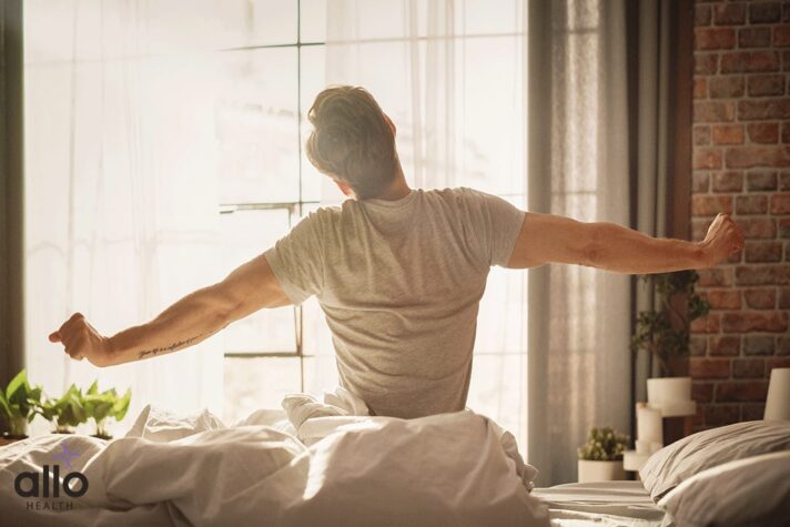 man woke up from bed and feeling the Morning Erections