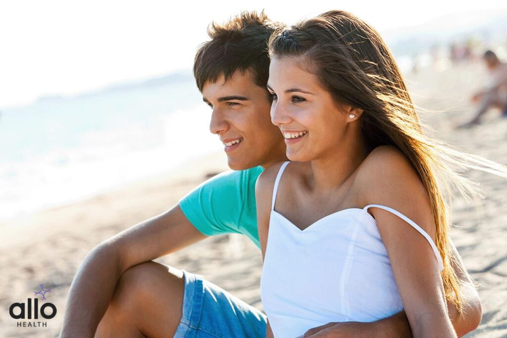 What Is Consensual Sex? 1 couple sitting on beach and discussing about Consensual Sex