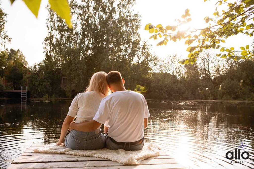 couple sitting and holding each other - Sensate Focus
