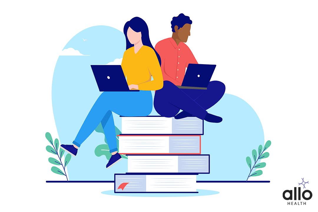 make and female sitting on books and studying about sex education through online