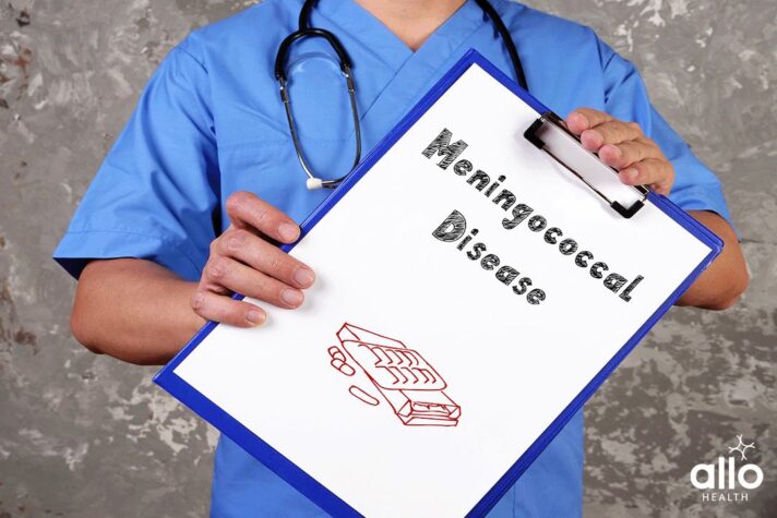 doctor holding a pad and explaining about the Meningococcal Disease?