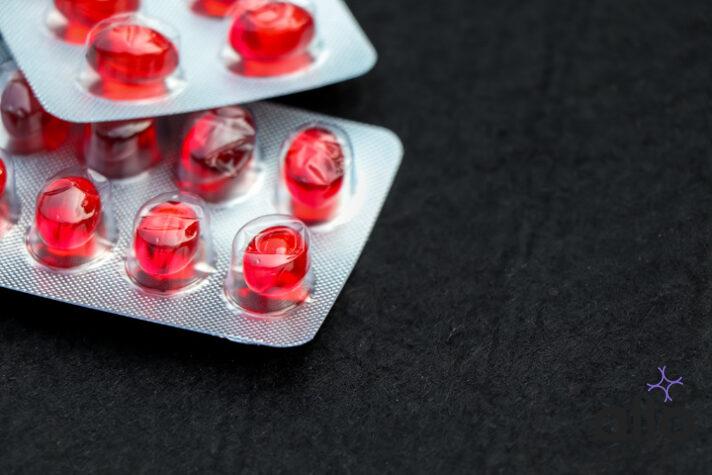 Optineuron Medicine Red round tablets in a packaging in capsules
