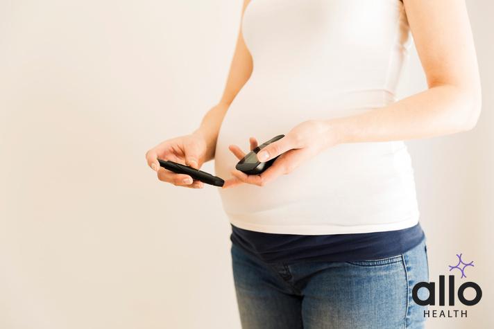 Pregnant woman checking blood sugar level. Gestational diabetes. Pregnancy health, gaba and erectile dysfunction
