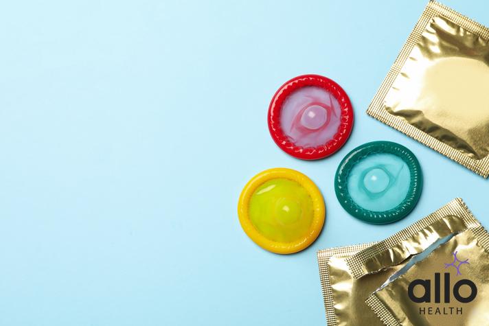 how to dispose of condoms, Multicolored condoms on blue background, space for text, condom broke hiv
