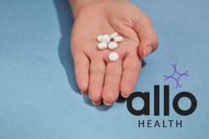 Top view of female hand with a handful of round white capsules in palm on a monochrome background. Concept of health protection drugs, functional foods. mifepristone and misoprostol tablets uses in hindi